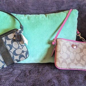 Mini Coach wristlet/purses in black or pink. Never used.